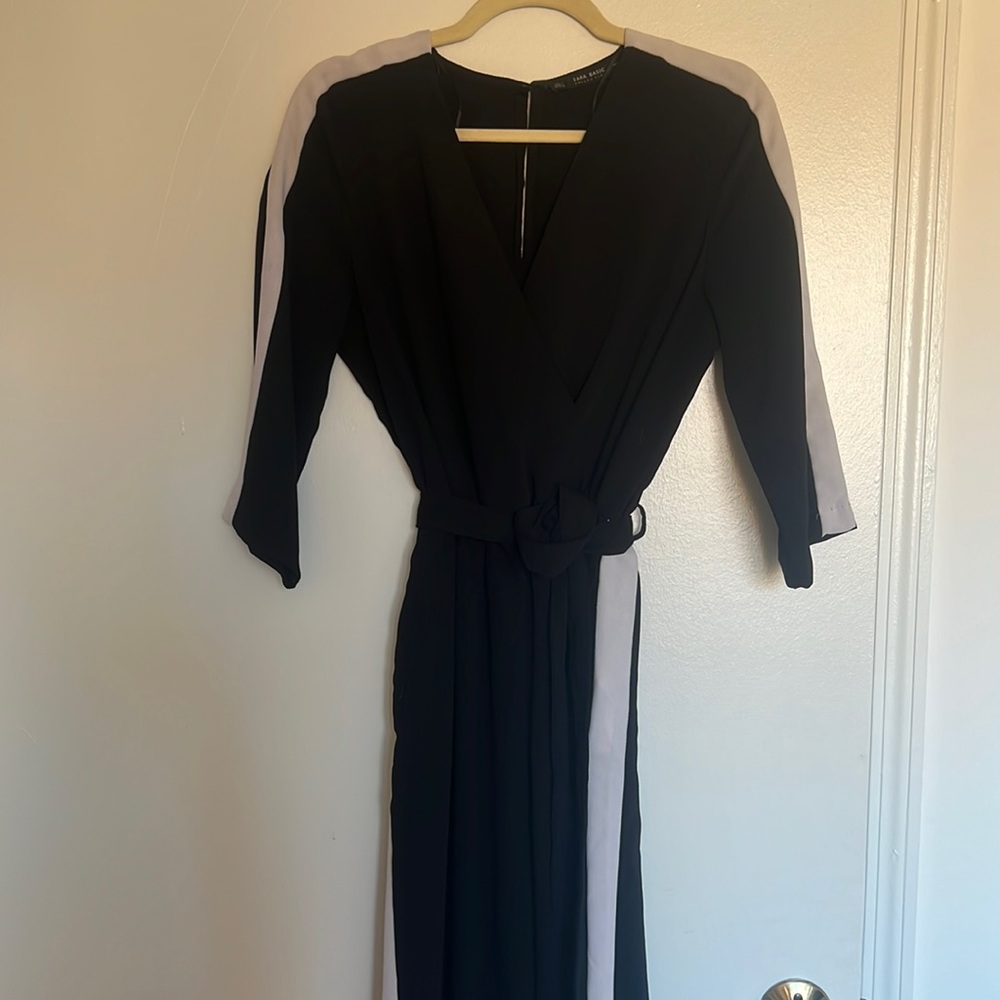 Black jumpsuit with slimming white detail on sides, can wear with/without belt